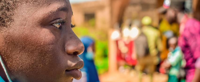 Close-up of a young person during a community eye screening event